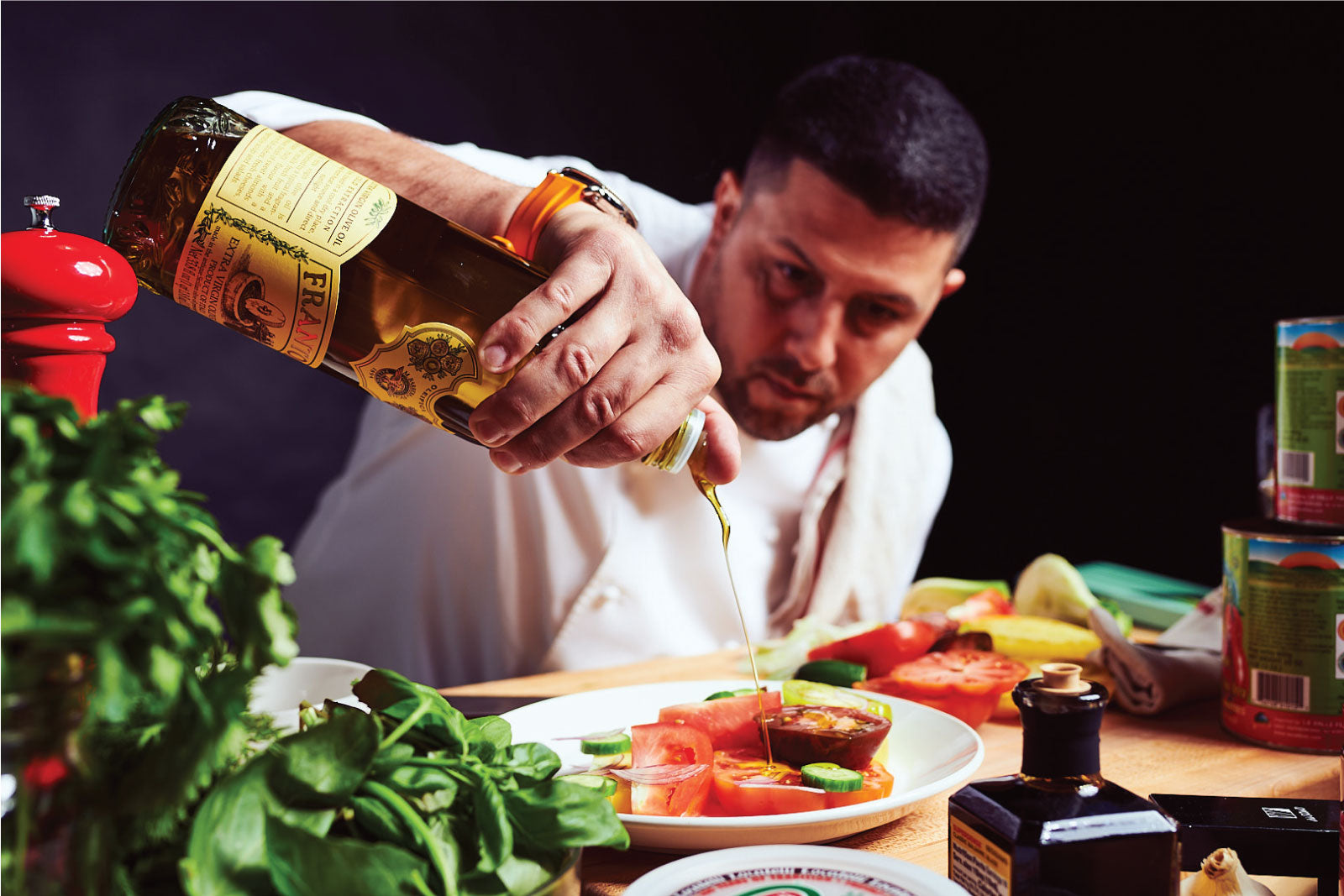 Chef Joe Isidori dressing an heirloom tomato salad